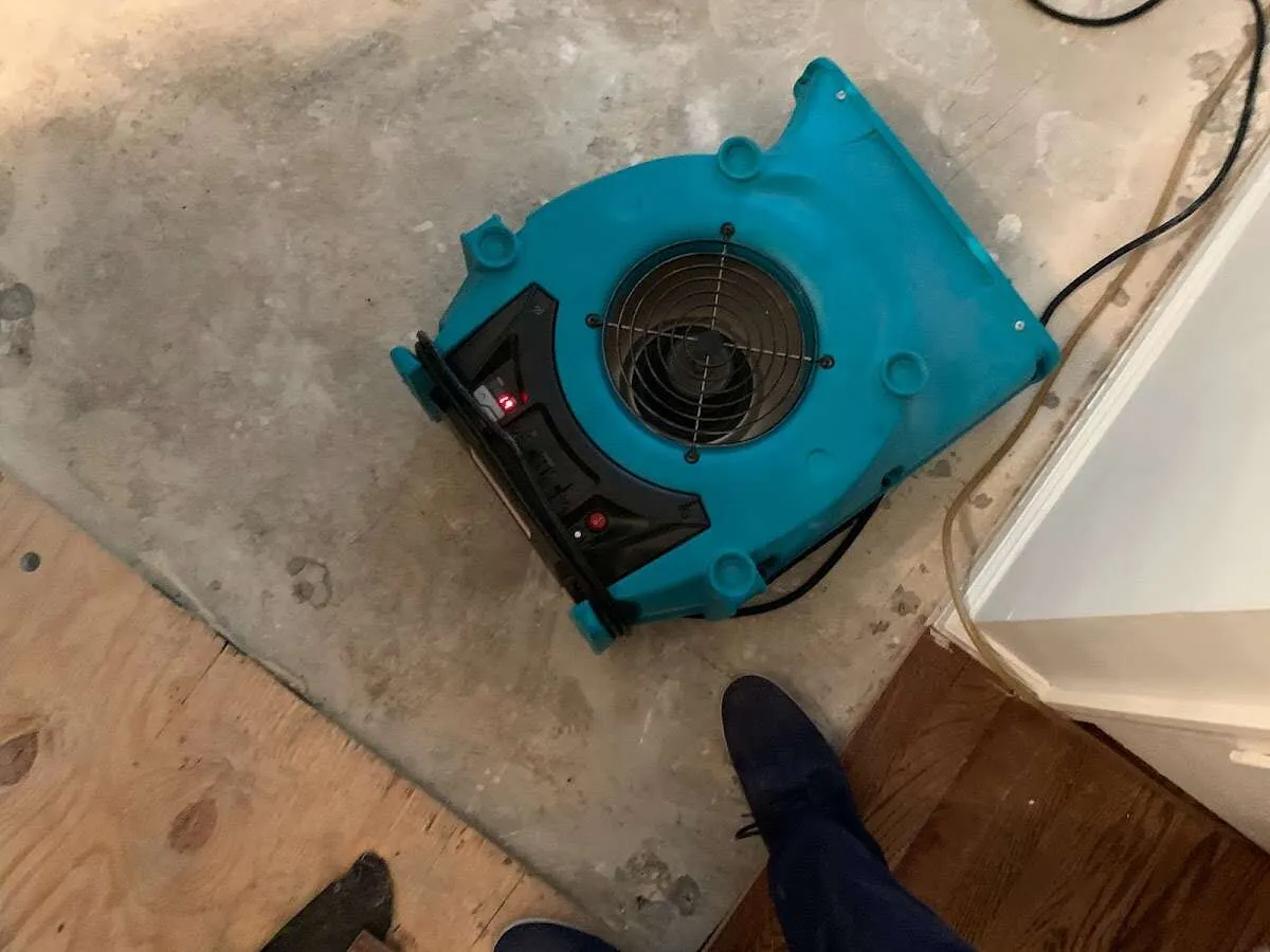 Air mover drying subfloor during Commercial Water Damage Restoration in Abilene